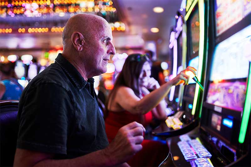 Playing slot machines and gambling in casino