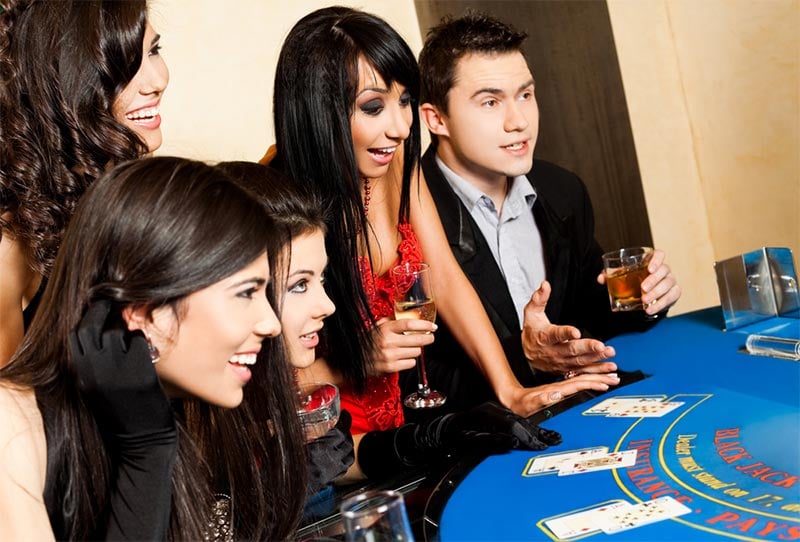 People enjoying a blackjack game